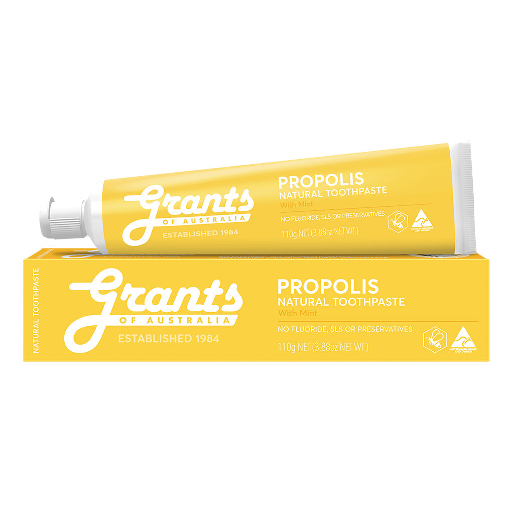 A tube of Grants Propolis Natural Toothpaste placed on its box